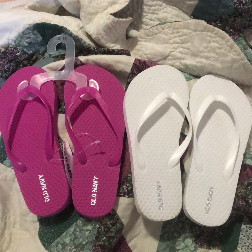 Magenta and white flip flops
